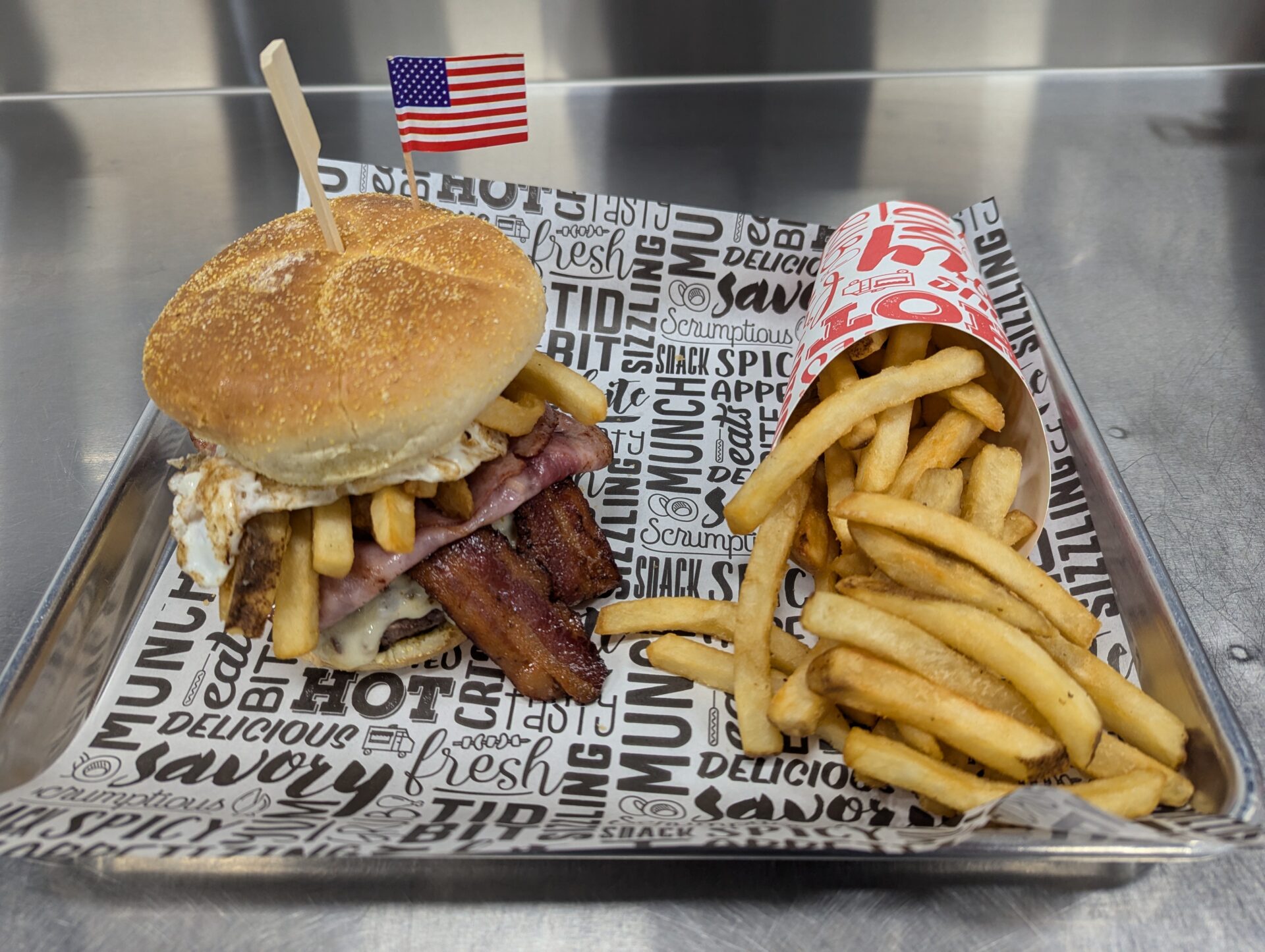 Dyckman Double - Double Bacon Cheeseburger topped with Ham, Fries and an Egg.